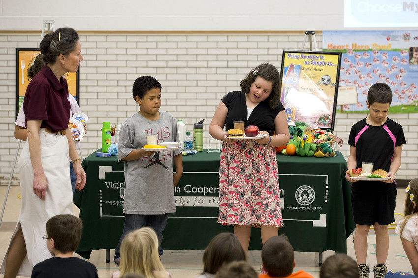 Sarah Burkett, Cooperative Extension Agent, teaches about nutrition and hygiene 