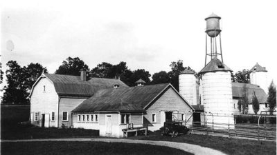 Barns on campus with the watertower in the background